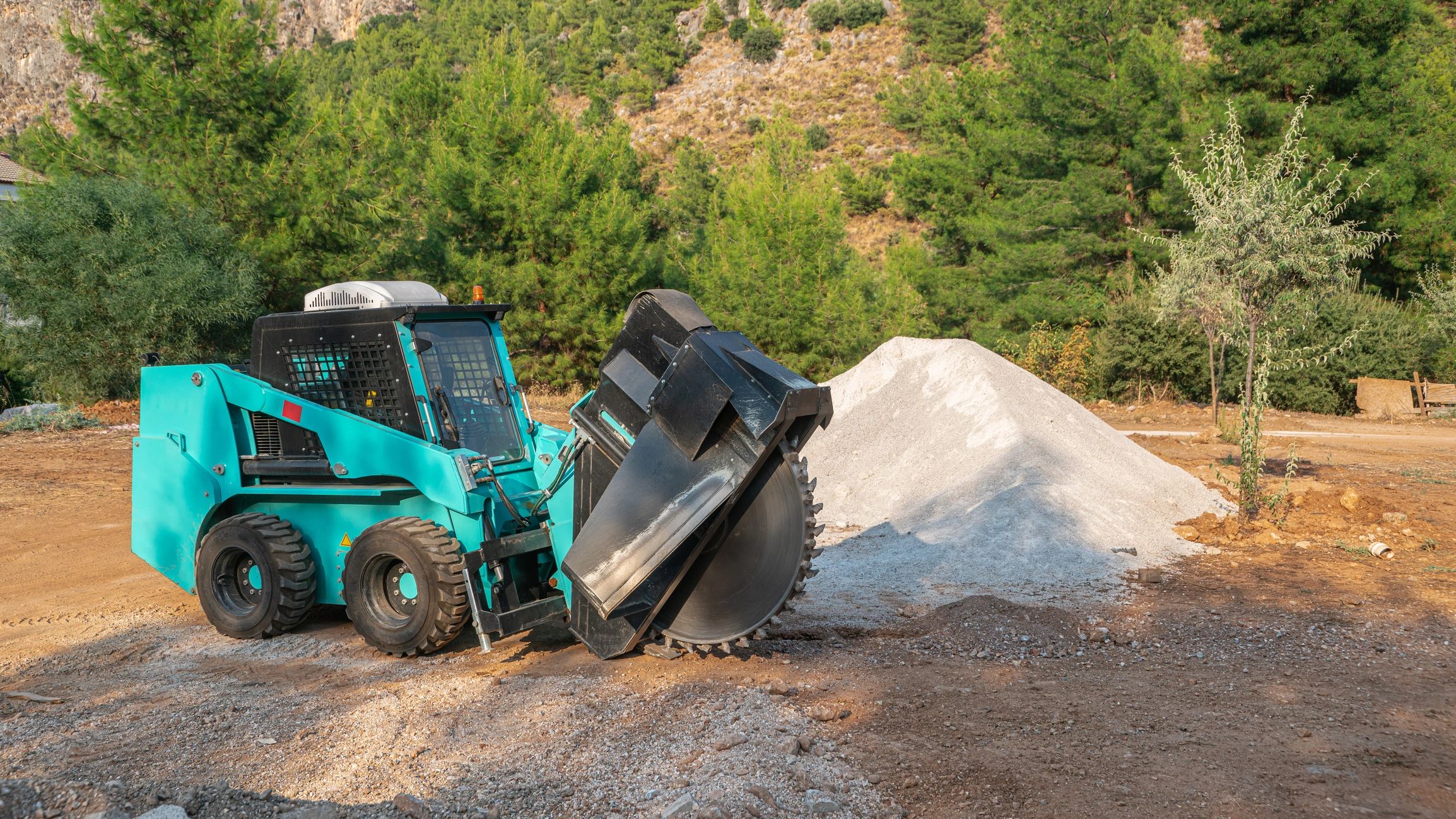 Construction equipment preparing a site for civil works