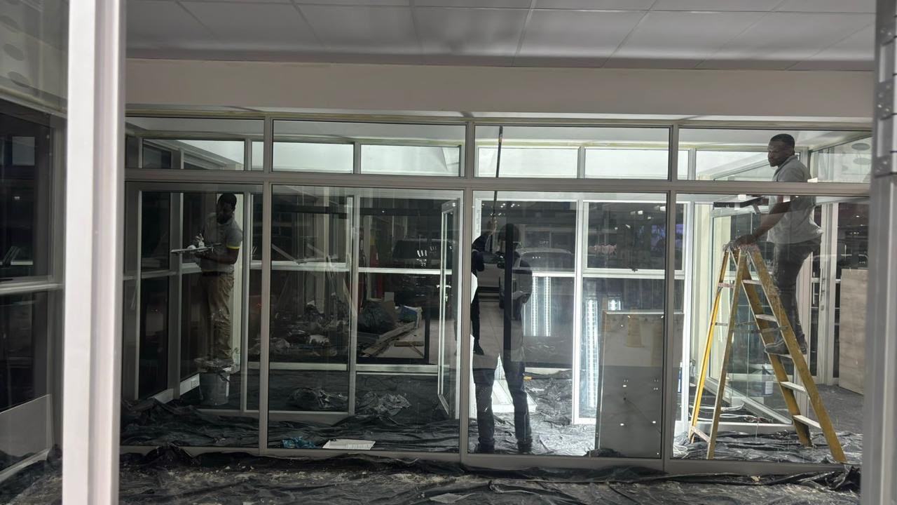Interior construction work behind glass and aluminium partitions